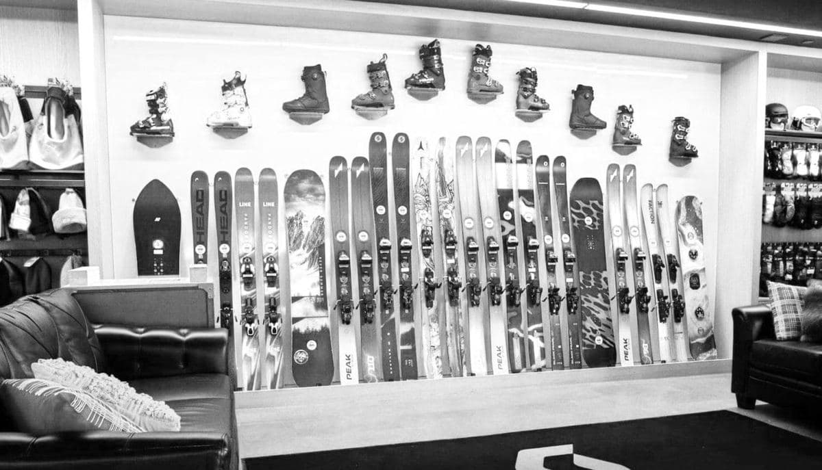 A traditional ski rental shop with skis on the wall